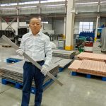 engineer-holding-bus-bar-titanium-clad-copper