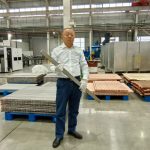 engineer-in-warehouse-with-titanium-clad-bus-bar