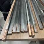 titanium-clad-bus-bar-samples-on-table